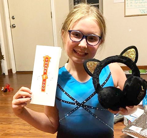 Fan holding Cats tickets